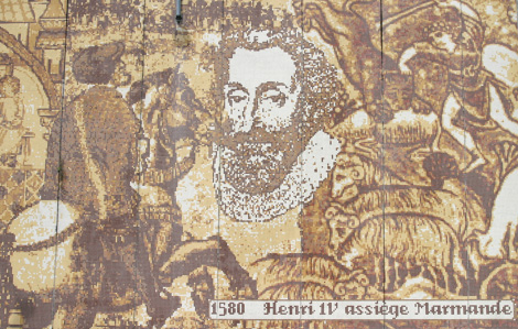 Cette photo est une mosaïque de teiente orangée qui représente Henry 4 qui assiège Marmande. On retrouve le visage de Henry 4
